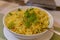 Yellow saffron rice with green garnish