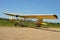 A yellow sailplane paraglider in an historical  East Prussian airfield Devau