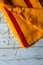 Yellow sari with red border on a background