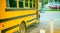 Yellow schoolbus parked along a city street, USA