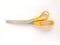 A yellow scissor with white background.