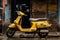 a yellow scooter parked on the side of the road