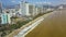 Yellow Sea Beach and People Gather Garbage Panorama