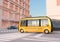 Yellow self-driving shuttle bus is driving through an intersection