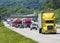 A yellow semi leads a packed line of traffic down an interstate in Tennessee