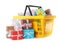 Yellow shopping basket with different gifts on background