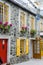 Yellow shutters on stone facade