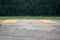 Yellow sign on concrete helipad