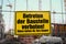 Yellow sign in german: Betreten der Baustelle verboten! Eltern h