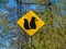 Yellow sign with a picture of squirrels