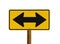 Yellow sign with two arrows pointing in opposite