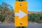 Yellow sign with white right arrow at Sabino Canyon State Park in Tucson, Arizona