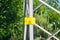 Yellow signboard danger on an iron electric pole