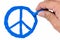 Yellow skin Asian man\'s right hand drawing blue color peace symbol