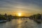 Yellow Sky at Golden Hour in Paris With Eiffel Tower Seine River and Bridges Trees