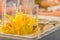 Yellow sliced mango in plastic bag with sweet sauce for sale at the fruit night market. Ready to eat sliced mango with sweet sauce