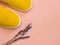 Yellow slip-on shoes on pink trendy background. Copy space for text.