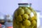 Yellow small apples in a glass jar, apple compote for the winter