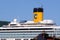 Yellow smokestack and bridges of the cruise ship Costa Fortuna anchored at the Italian port of La Spezia