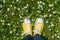 Yellow sneakers in a dasiy field. First person view