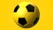 Yellow soccer ball on yellow background.