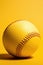 Yellow softball on yellow plain studio background, athletic minimal baseball sports