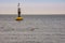 Yellow solar buoy near coast of Cuxhaven in Germany in Autumn