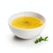 Yellow Soup With Basil On White Background