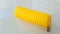 Yellow spiral air hose for portable car tire pump