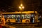 Yellow stands on the trolley Electronics stopping and waiting for boarding the night on the square in Lviv