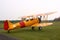 Yellow stearman biplane