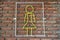 Yellow steel coil signs, female toilet symbols on brick walls, background