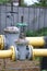 Yellow steel pipes and valve at gas distribution station, gas piping, gas pipeline