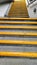 Yellow steps near local train station