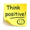 Yellow sticker with black postit `Think positive!`, note hand written - vector