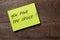 Yellow sticker on a dark wooden background with the handwriting phrase to encourage a decision: you have the choice