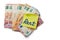 Yellow sticker with hand written sign rent on pile of Euro bank notes on white isolated background. Paying household bills concept