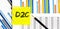 Yellow sticker with text D2C on chart with pencil . It can be used as a business and financial concept