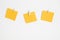 Yellow stickers on clothespins on white background. Copyspace for text.