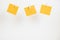 Yellow stickers on clothespins on white background. Copyspace for text.