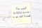 Yellow sticky note with handwritten motivational quote