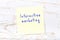 Yellow sticky note with handwritten text interactive marketing