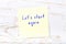 Yellow sticky note with handwritten text lets start again