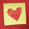 Yellow sticky note with Valentine`s heart.