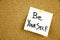 A yellow sticky note writing, caption, inscription Be your best self - positive words on a slate blackboard in black ext