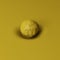 Yellow stone or sphere on a yellow canvas deforms a plane