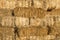 Yellow straw bale wall texture background