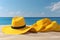 Yellow straw hat on the beach and white clouds abstract background. Copy space of summer vacation