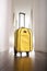 Yellow suitcase at hall house