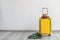 Yellow suitcase with hat and sunglasses near light wall indoors